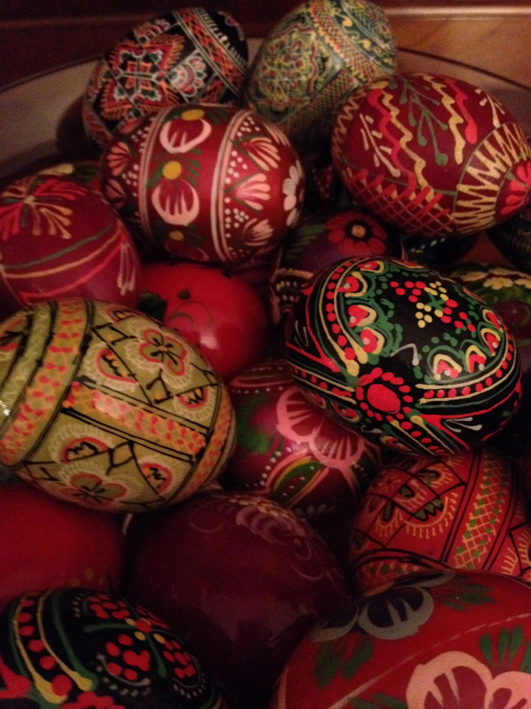 Colorful intricately decorated Easter eggs in basket.